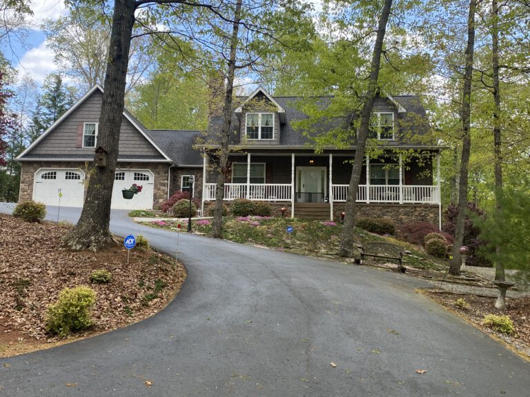 House with long driveway and large porch