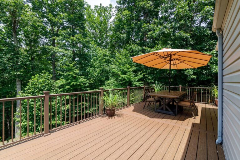 deck construction in Goodview VA near Roanoke - table and umbrella on porch