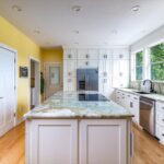 Smith Mountain Lake Home Remodel - kitchen remodel with granite island counter and vibrant yellow walls