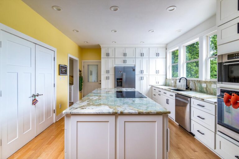 Smith Mountain Lake Home Remodel - kitchen remodel with granite island counter and vibrant yellow walls
